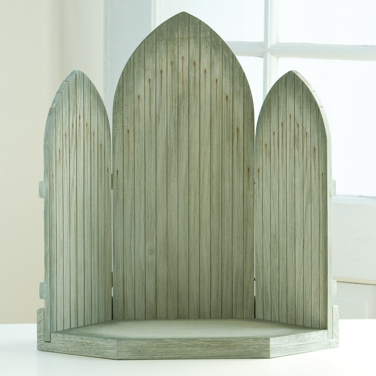 Open light grey wooden barn doors with three openings
