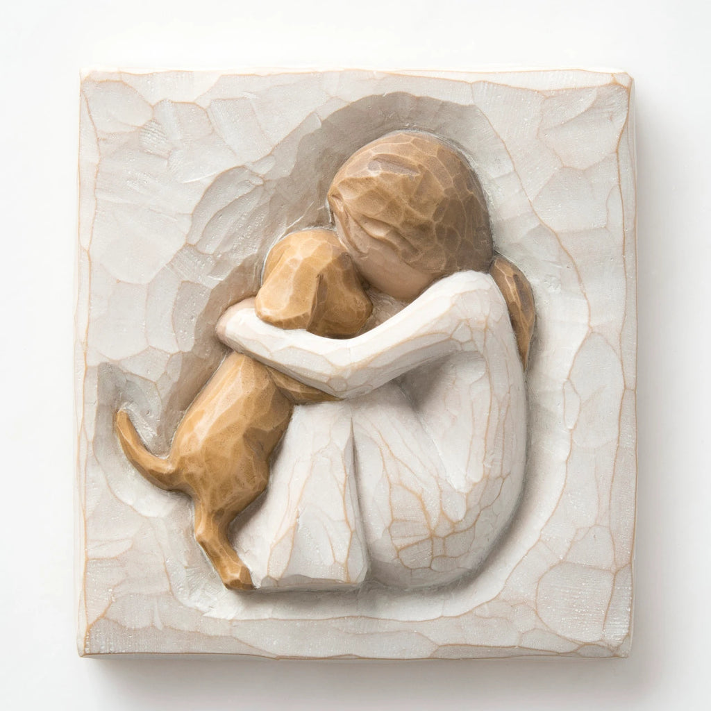Close up white plaque - image of little girl figurine holding golden puppy