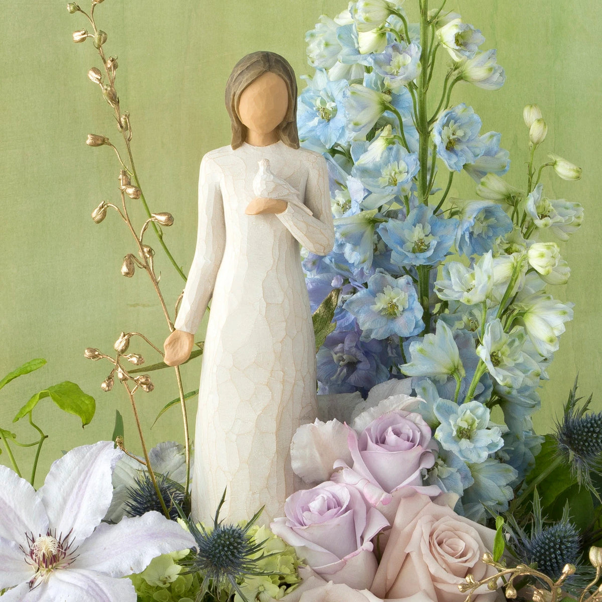 Willow Tree With sympathy, 9”h hand-painted standing resin figure in cream dress, holding white dove on hand, nestled in floral bouquet