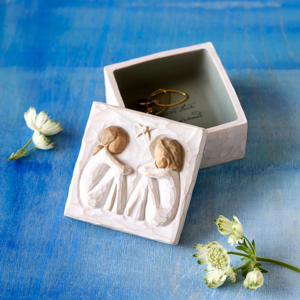 Willow Tree Friendship Keepsake Box, 3”sq x 2”h hand-painted resin box with removable lid off to one side. Lid has bas-relief carving of two seated figures in cream dresses, facing each other, inside of box has sentiment