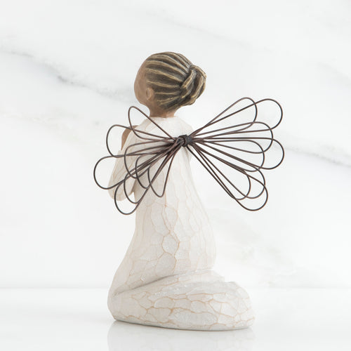 Small brunette girl figurine in white dress kneeling with brown wire wings
