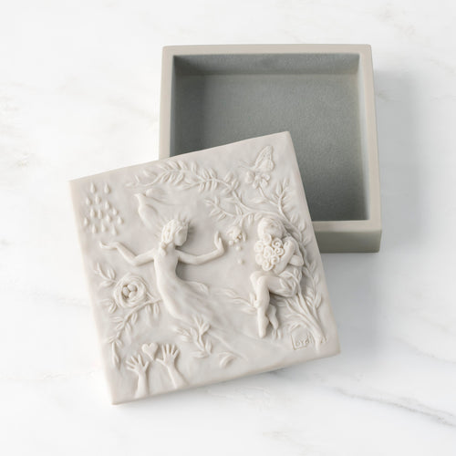 White resin box with detached lid carved with figural and organic imagery; velvety gray-green finish in box base