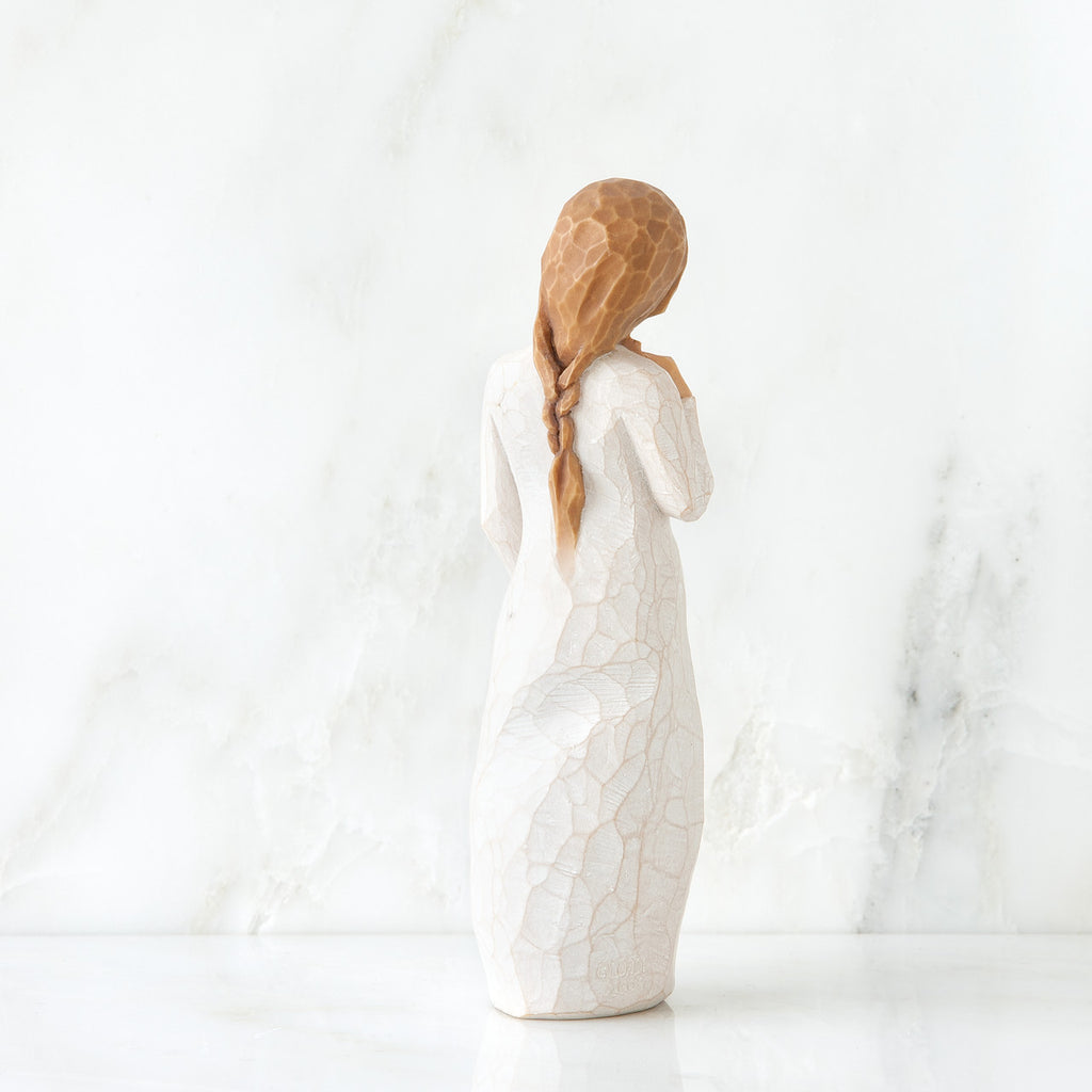 Back view of red haired girl in white dress