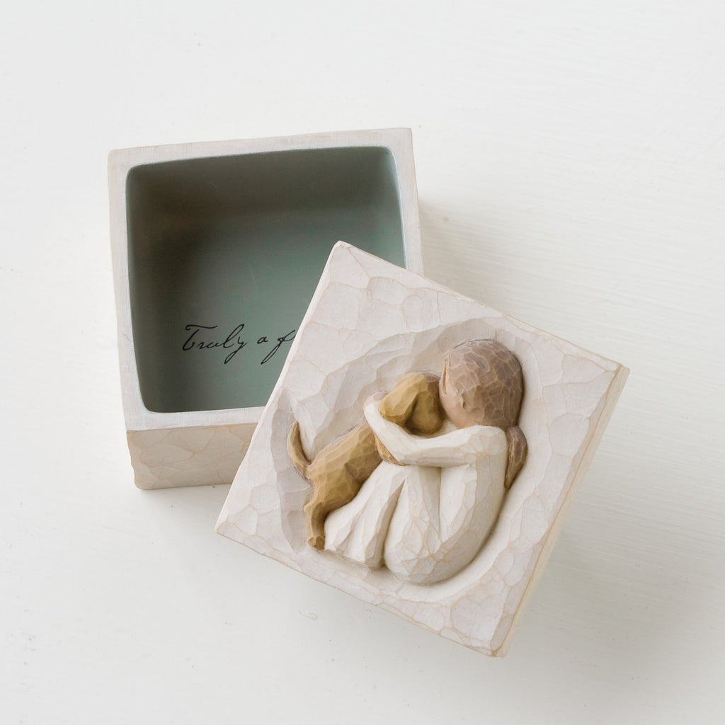 Open square white wooden keepsake box - top of lid is carved in faceless girl holding faceless brown puppy