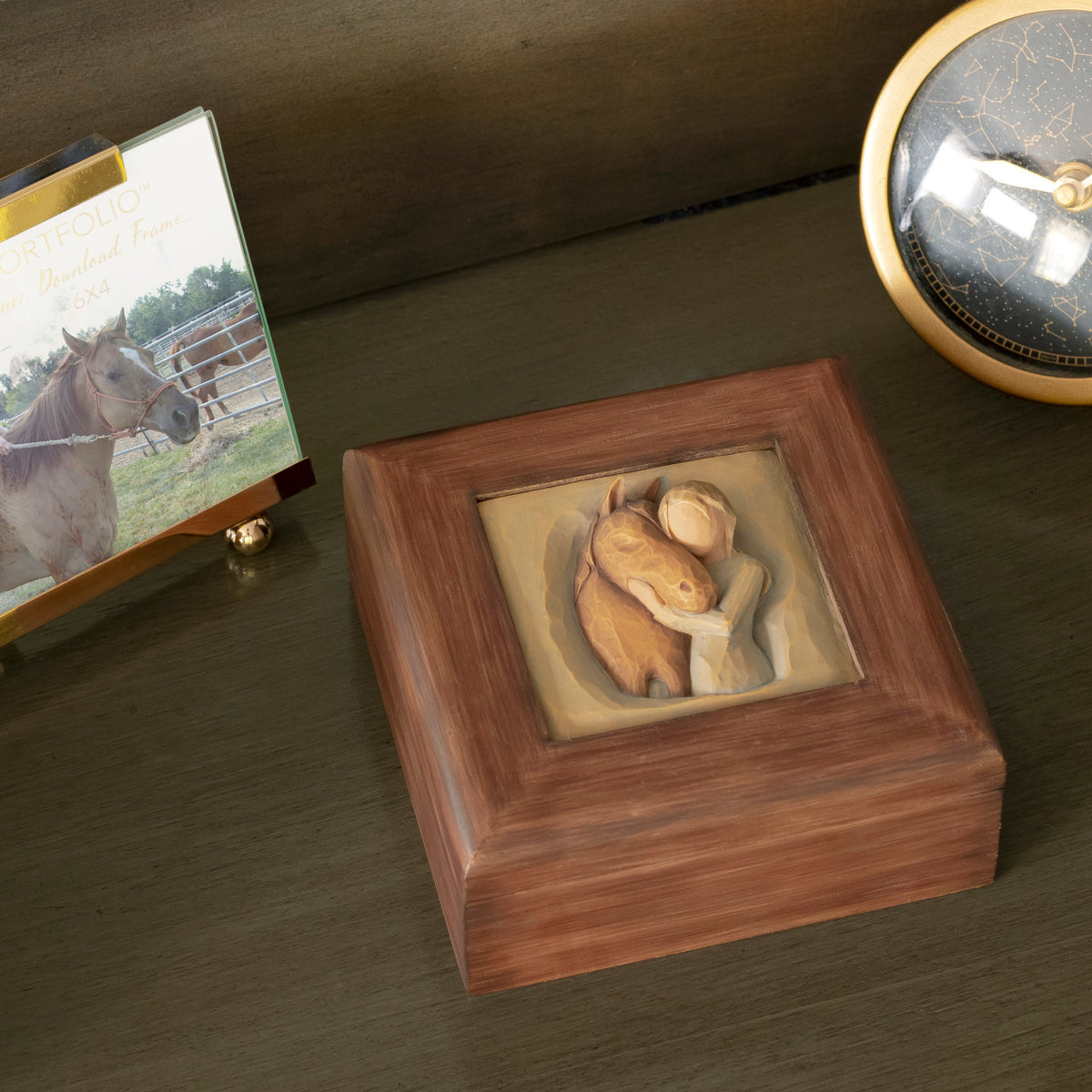Willow Tree Quiet Strength Memory Box, 4.75” sq x 2”h  hand-painted red-brown wood box with bas-relief resin carving of girl in green dress, arms embracing horse on hinged lid