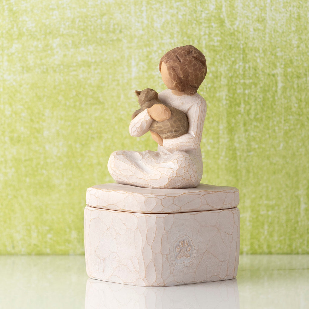 Willow Tree Kindness (girl) Keepsake Box, 3"sq hand-painted cream resin box with 3”H figure of seated girl holding cat affixed to lid, in front of lime green painting
