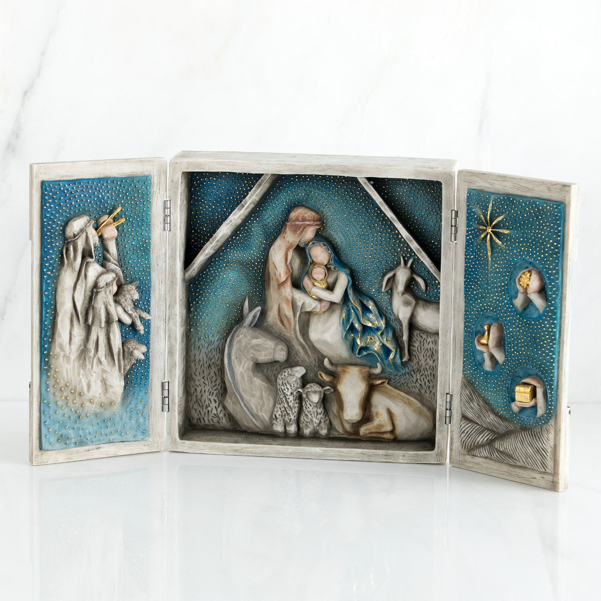 Open nativity scene book plaque - starry night background with images of figurines around manger scene